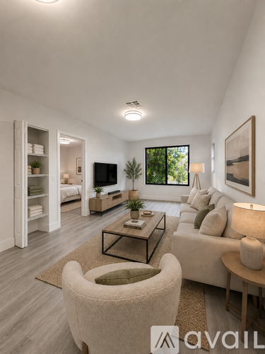 A living room with a sofa, armchair, and a coffee table.