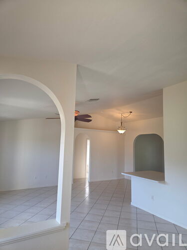 A room with white walls and a tiled floor.