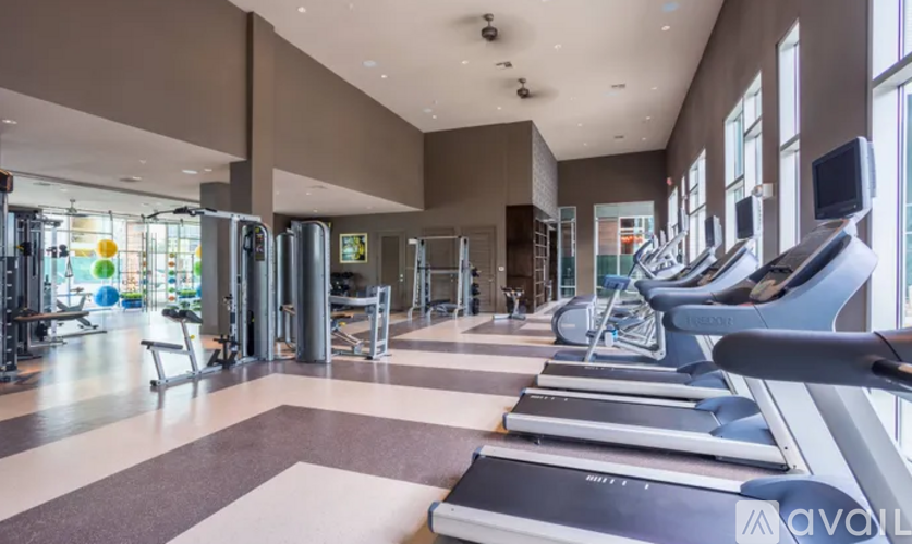 A gym with treadmills and other exercise equipment.