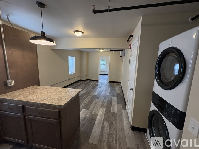 A laundry room with a washer and dryer.