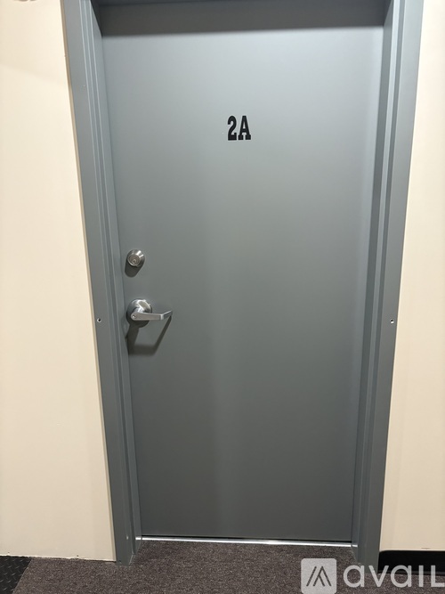 A grey door with the number 2A on it.