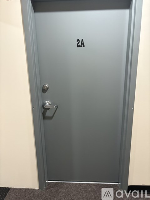 A grey door with the number 2A on it.
