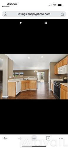 A modern kitchen with wooden cabinets and a central island.