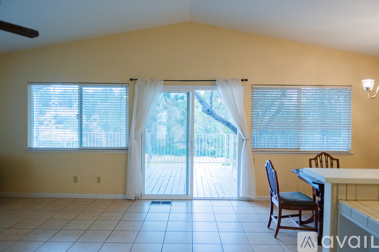 A dining room with a table and chairs is shown.