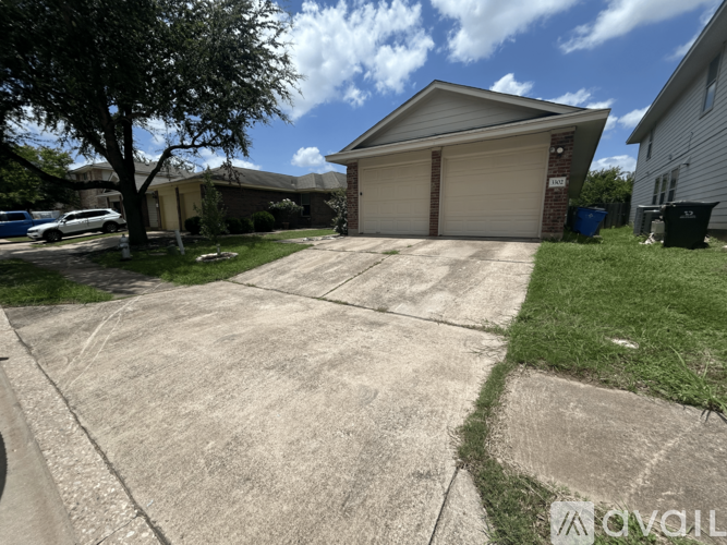 A house with a driveway in front of it.