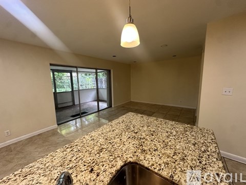 A kitchen with granite countertops and a sink.