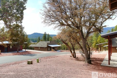 A view of a courtyard with a mountain in the background.