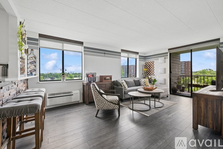 A living room with a sofa set and a dining table.