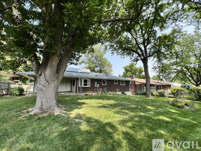A house with a tree in front of it.