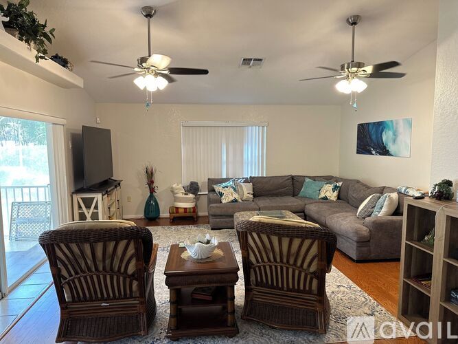 A living room with a brown chair and a brown coffee table.