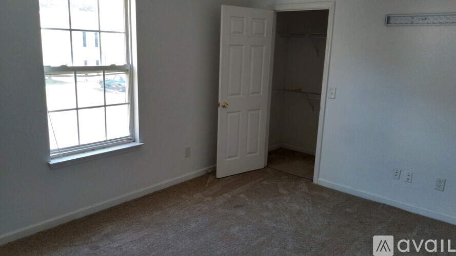 A room with a door and a window.
