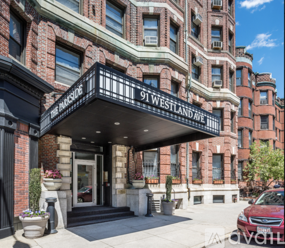 The entrance to a building with a sign that reads "91 Westland Ave."