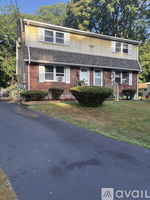 A house with a driveway in front of it.