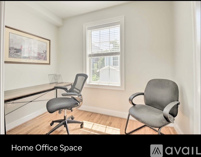 A home office space with a chair and a desk.