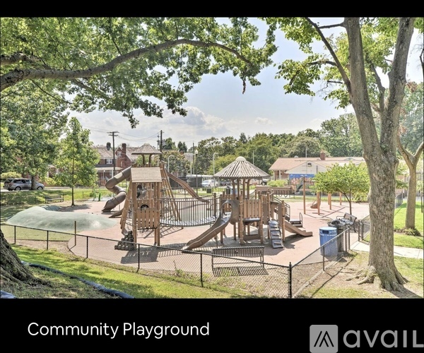 A playground with a slide, swings, and a climbing structure.