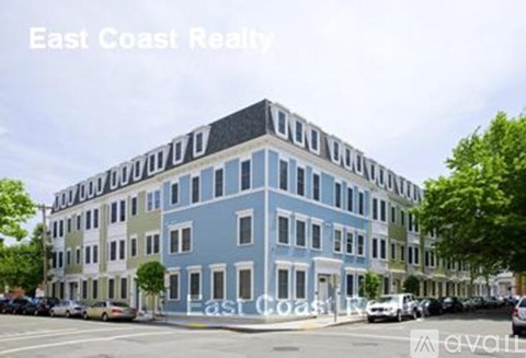 A blue building with East Coast Realty written on it.
