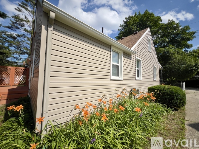 A house with a garden in front of it.
