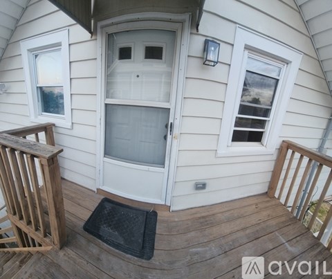 A small house with a white door and a window.