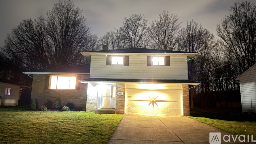 A house with a lit-up star on the garage door.