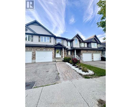 A large house with a driveway in front of it.