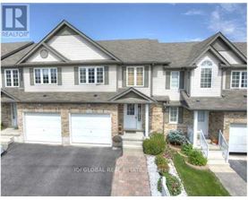 A large, two-story house with a garage is for sale.