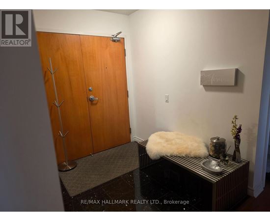 A brown door with a silver handle and a sign that says REALTOR.