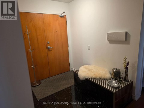 A brown door with a silver handle and a sign that says REALTOR.