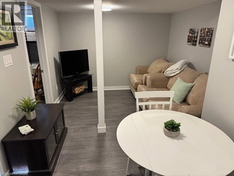 A living room with a white table and a couch.