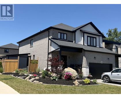 A modern house with a well-maintained front yard.