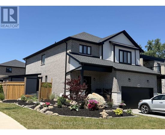 A modern house with a well-maintained front yard.
