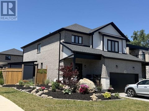 A modern house with a well-maintained front yard.