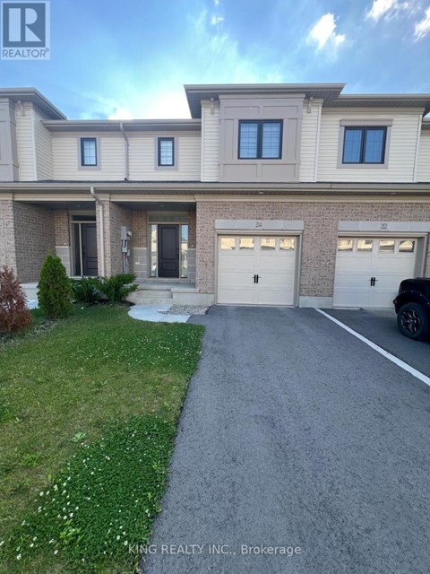 A house with a driveway in front of it.