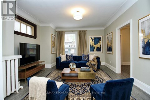A living room with a blue couch and a television.