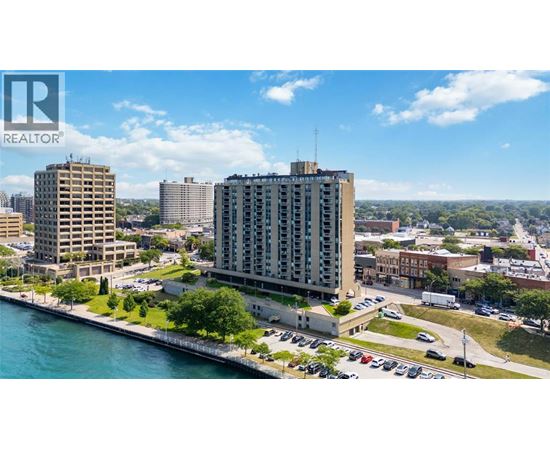A cityscape with a body of water in the foreground and a Realtor logo in the corner.