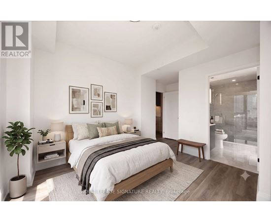 A bedroom with a large bed and a plant.