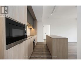 A modern kitchen with a microwave above the counter.