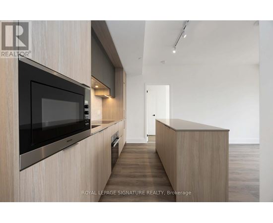 A modern kitchen with a microwave above the counter.