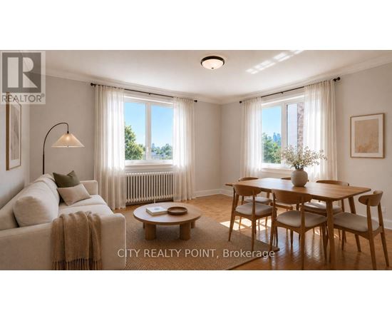 A well-lit living room with a couch, coffee table, and dining table.