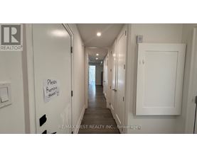 A hallway with a sign that says "Please Remove Stools".