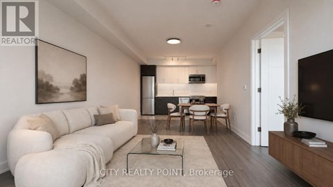 A modern living room with a white sofa and a glass coffee table.