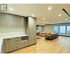 A modern kitchen with wooden cabinets and a large island.