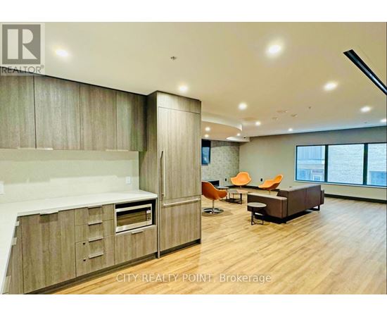 A modern kitchen with wooden cabinets and a large island.
