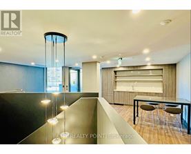 A modern dining area with a glass table and chairs.