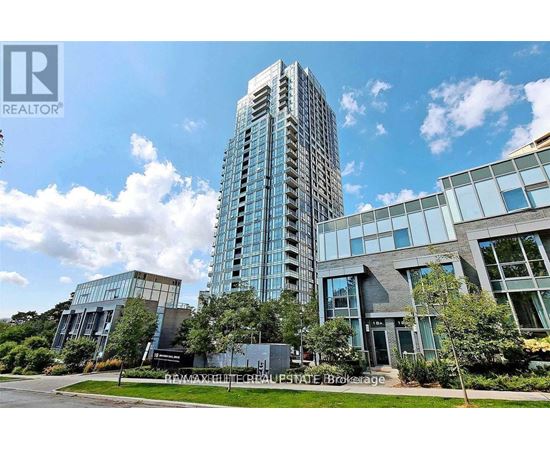A modern building with a glass facade stands tall in the skyline.