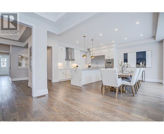 A spacious kitchen with a dining table set for four.