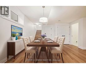 A dining room with a wooden table and chairs.