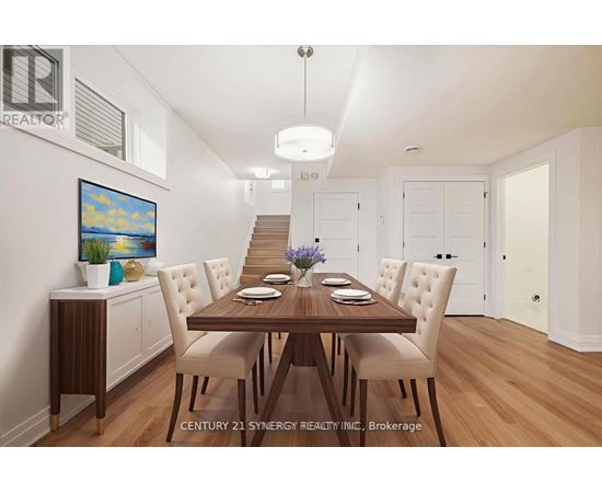 A dining room with a wooden table and chairs.