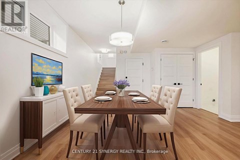 A dining room with a wooden table and chairs.