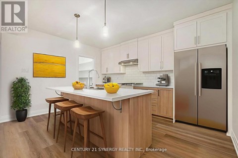 A kitchen with wooden cabinets and a white countertop.