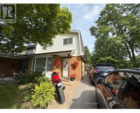 A house with a motorcycle parked in front of it.